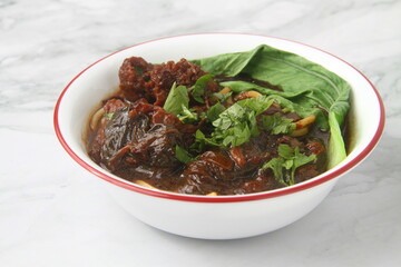 Freshly cooked Beef Mami or beef tenders served with noodles soup