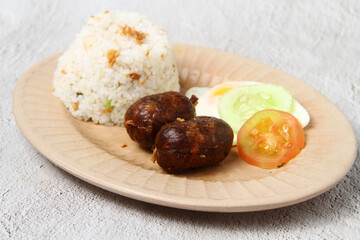 Freshly cooked Filipino food called Longsilog or cured pork sausage, egg and fried rice