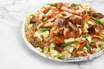 Freshly cooked Filipino food called Pancit Bihon with Lechon