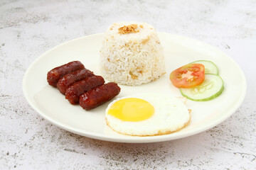 Freshly cooked Filipino food called Longsilog or cured pork sausage, egg and fried rice