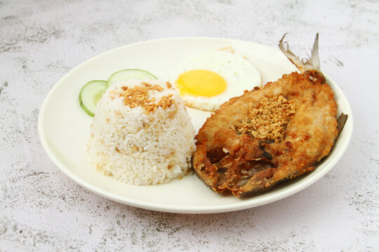 Freshly cooked Filipino food called Bangsilog or fried bangus or milkfish, egg and fried rice