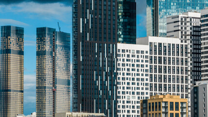 Obraz premium urban landscape with high-rise buildings and a panoramic view of the city on a summer day taken from a drone