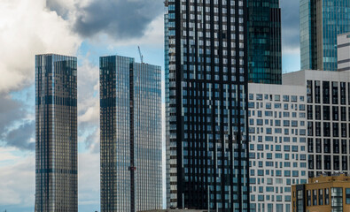 Fototapeta premium urban landscape with high-rise buildings and a panoramic view of the city on a summer day taken from a drone