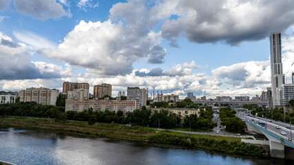Obraz premium urban landscape with high-rise buildings and a panoramic view of the city on a summer day taken from a drone