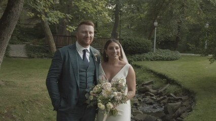 A soon-to-be-married couple poses for wedding portraits that will be cherished for years to come.  A happy smile on their face and a feeling of togetherness embody this well-dressed couple.