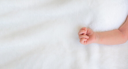 Close up newborn baby hand over white background with copy space, happy family’s day. be mother. new family and style life.  Concept of child care, feeling safe, parent love.