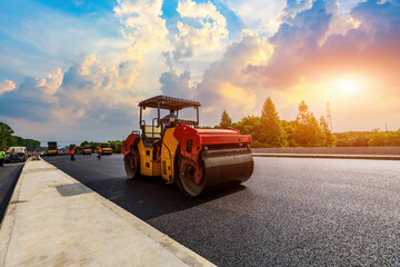 Construction site is laying new asphalt pavement, road construction workers and road construction...