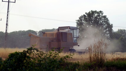 Fototapeta na wymiar combine harvester working on a field