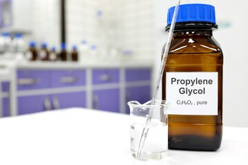 Selective focus of propylene glycol liquid chemical compound in dark glass bottle inside a...