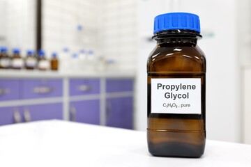 Selective focus of propylene glycol liquid chemical compound in dark glass bottle inside a...