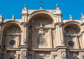 Fototapeta na wymiar Parte superior fachada principal de la basílica catedral del siglo XVI de Granada, de estilo barroco y renacimiento, España