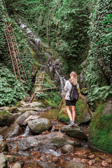 Travel. Girl travels through the mountains and waterfalls of wild nature. Unity, mental health, eco travel. Hiking in the mountains, van life vibes, travelling,good moments, digital detox