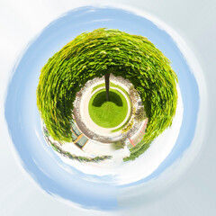 Aerial summer city view with trees in the park,blue sky. Little planet sphere mode. Spherical panorama of the city,Moscow, Russia