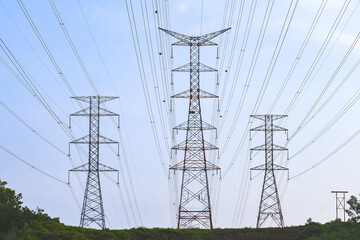 Electricity transmission pylon, high voltage power lines tower. Consumers pay more for electricity...