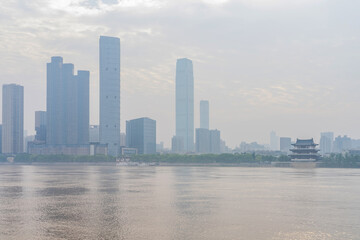 Fototapeta premium The skyline of urban buildings and the scenery of the Yangtze River in Changsha, Hunan Province, China
