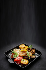 Grilled vegetables in a cast iron grill pan, top view