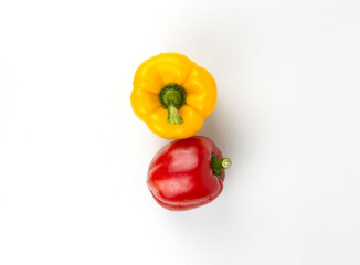 Red and yellow bell peppers isolated on white background. organic fruits for healthy meal cooking