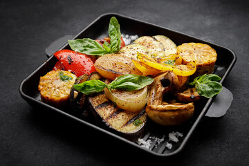 Grilled vegetables in a cast iron grill pan, top view