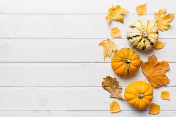 Autumn composition. Pattern made of dried leaves and other design accessories on table. Flat lay,...