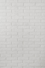 vertical background: white decorative plaster bricks on the wall