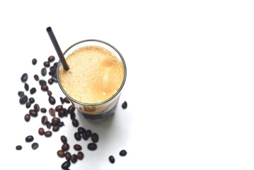 Iced milk espresso with coffee beans on white background closeup