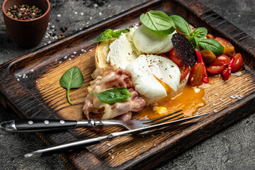 Delicious breakfast or snack bread toast with poached egg and fried bacon. Healthy fats, clean eating for weight loss. Keto diet concept. top view