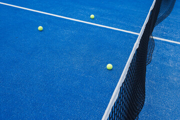 Paddle tennis balls on a paddle tennis court for background