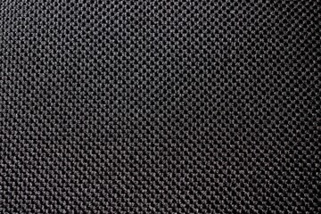 fabric in black color background texture closeup