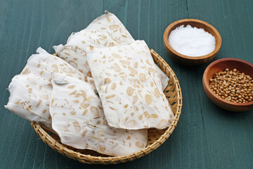 Raw Tempeh, Tempeh or Tempe, Indonesian traditional food, made from fermented soybeans. Usually fried for a side dish or for other cooking ingredients.
