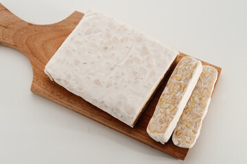 Raw Tempeh, Tempeh or Tempe, Indonesian traditional food, made from fermented soybeans. Usually fried for a side dish or for other cooking ingredients.
