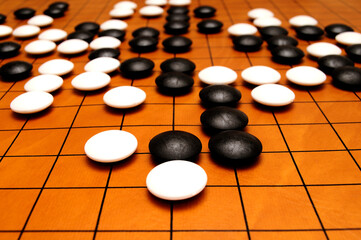 tiles of the Go game on the Goban during a game