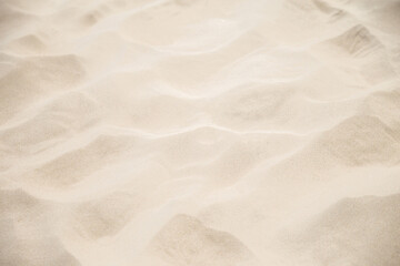 Fototapeta na wymiar Sand Texture. Brown sand. Background from fine sand. Close-up image. Sandy beach for background. Top view. High resolution texture.