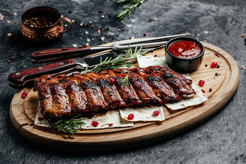 Spicy rack of spare ribs with BBQ sauce served on wood chopping board, Restaurant menu, dieting, cookbook recipe top view