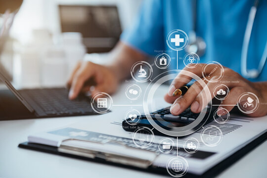 Healthcare Costs And Fees Concept. Doctor Used A Calculator And Tablet For Medical Costs In Modern Hospital With VR Icon Diagram.