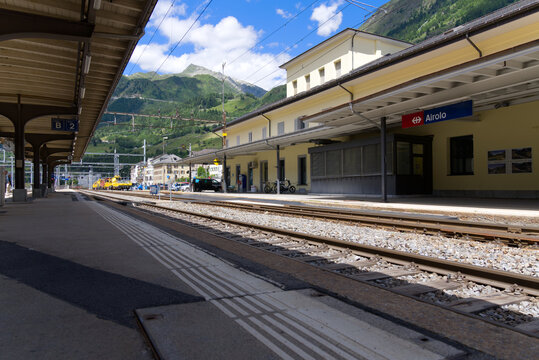 Railway station Airolo, Canton Ticino, with railway tracks and platform on a sunny summer day. Photo taken June 25th, 2022, Airolo, Switzerland.