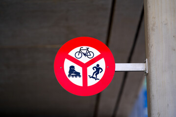 Close-up of traffic sign at railway station no cycling, no in-line skating and no skateboarding on...