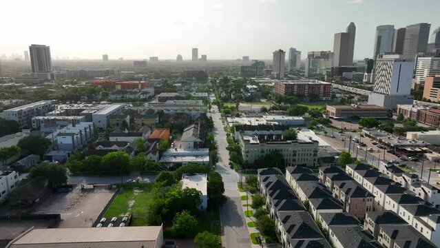 Texas city aerial truck shot of housing growth and homes. Hazy summer day.