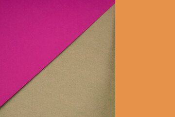 Textured and plain pink orange brown sheet papers forming two triangles and vertical blank rectangle for creative cover designing