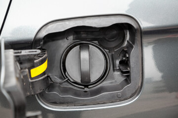 Open hatch of a car gas tank....