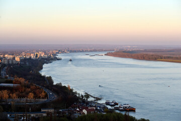 Obraz premium Aerial photography of cargo ships sail on the Danube river at sunset near Galati city, Romania.