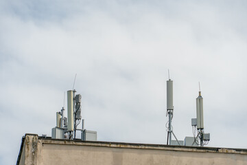 New GSM antennas on the roof of a building for transmitting a 5g signal are dangerous to health. Radiation pollution of the environment through cell towers. The threat of extinction of the population