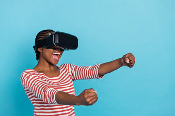 Photo of excited positive lady arms steer imagine wheel wear vr glasses isolated on blue color background