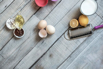 Cake baking ingredients on a wooden background, isolated, close up, still life photography