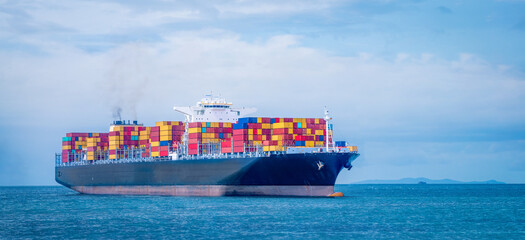 cargo ship and truck at seaport waiting for container dock crane shipment harbor loading container...