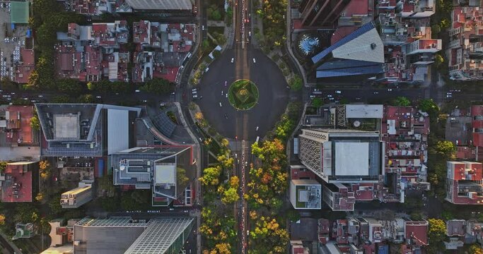 Mexico City Aerial v25 vertical drone flyover downtown across paseo de la reforma capturing traffics at the roundabouts and angel of independence at sunset - Shot with Mavic 3 Cine - December 2021