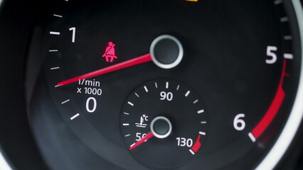 Starting car engine. Dashboard in the car. Tachometer Gauge of Starting and Stopping Car Close Up.