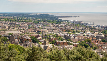 Fototapeta na wymiar Dundee, Scotland, UK – June 23 2022. Dundee city and the Firth of the Tay captured from above on Law Hill