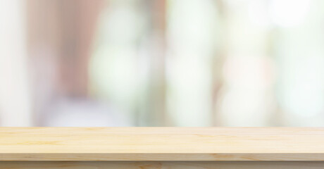Empty wood table top with cafe restaurant interior blurred background