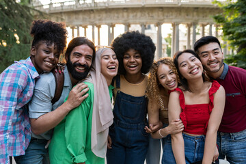 group of young multiracial friends traveling in the city