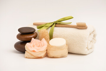 Obraz na płótnie Canvas Spa treatment with zen stones,soap,candle isolated on white background.